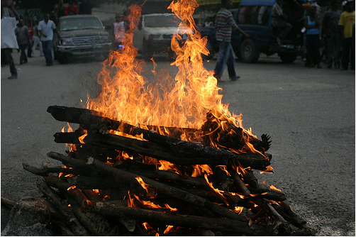 Haiti's pre-Carnival Celebration, two days before the quake. A chicken burns in the fire.  (photo E. Parker)